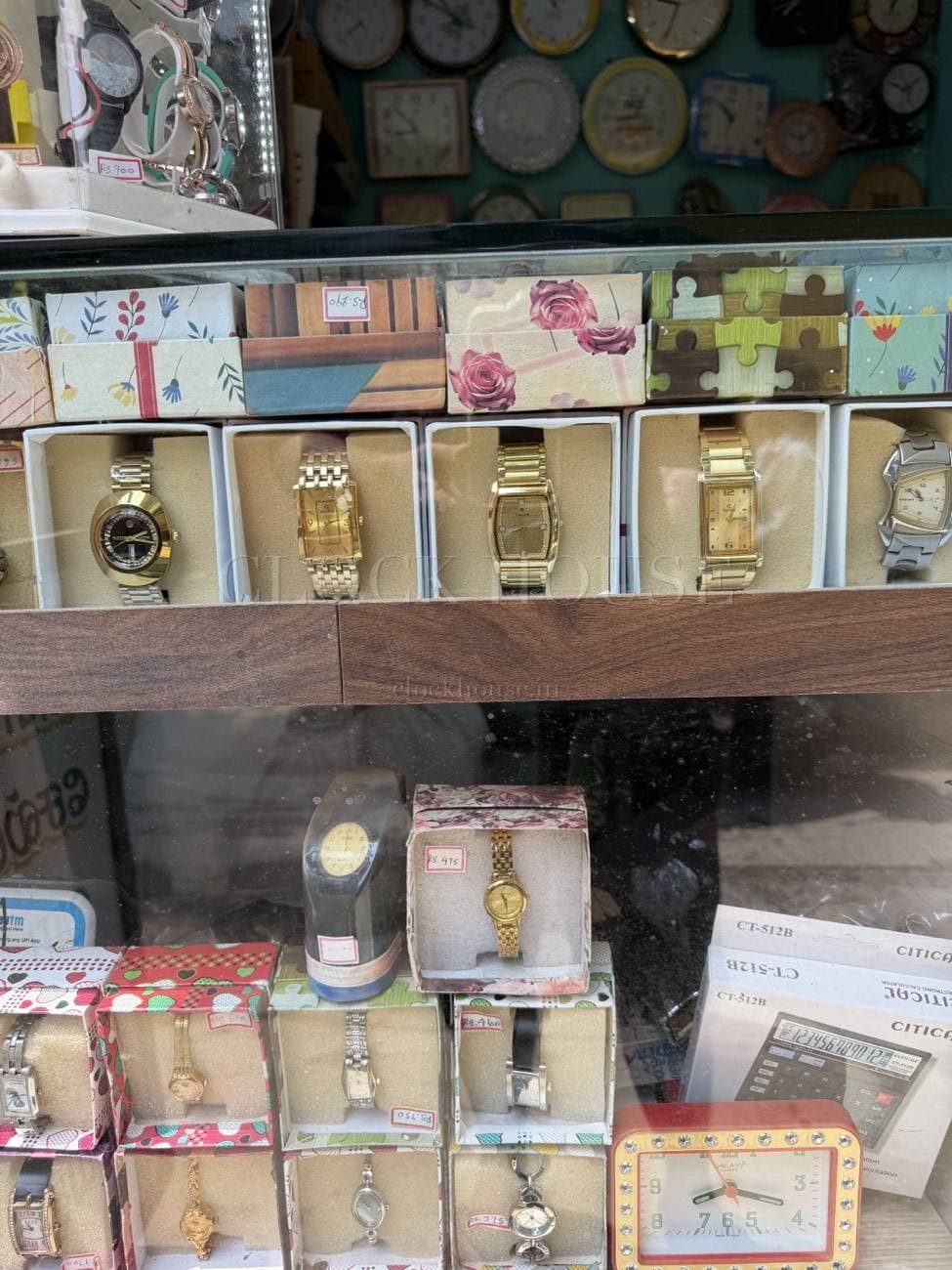 Men's gold and dress watches on display at Clock House